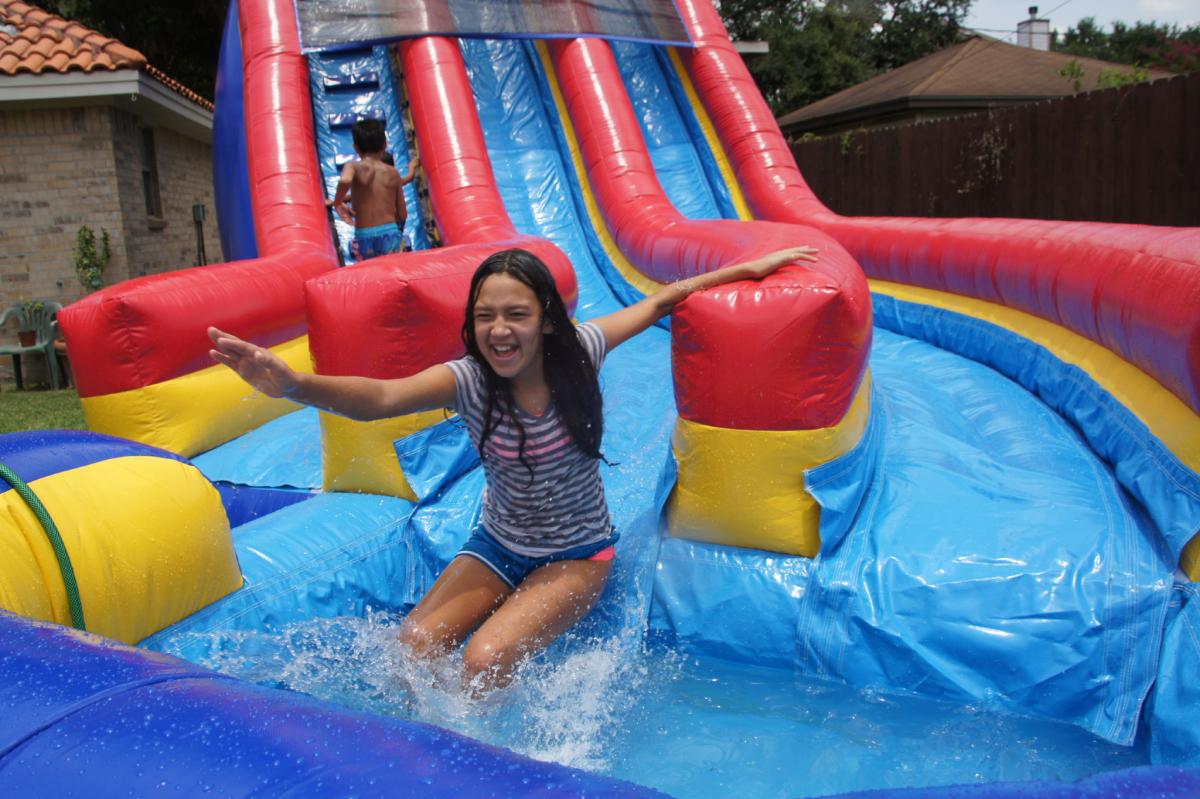 7 Water Slides That Will Make Your Backyard Into A Water ...